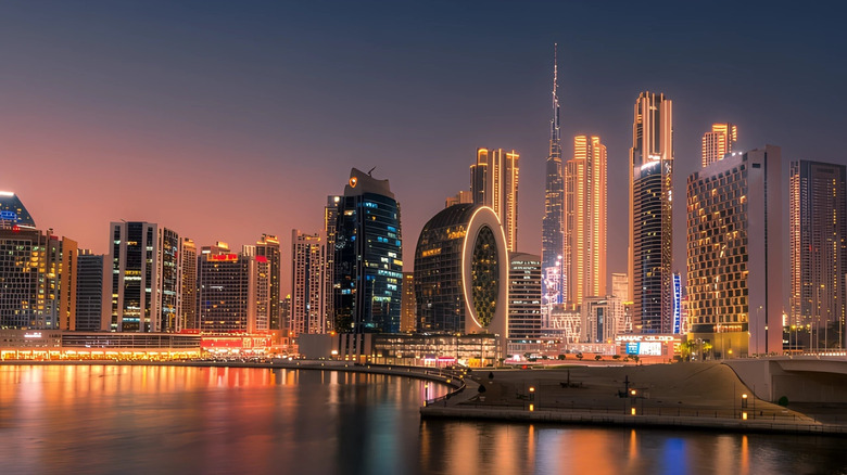 The Dubai skyline lit up at dusk