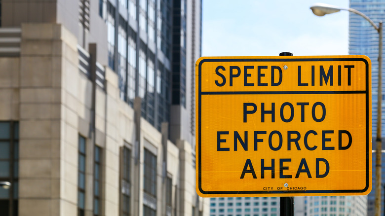 Speed limit photo enforced ahead yellow sign downtown Chicago
