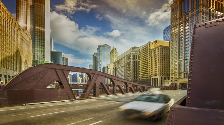 Car speeding Chicago downtown golden light