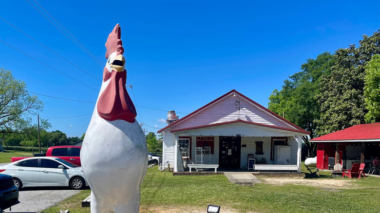 A large chicken statue in the yard outside of a small restaurant in Belton, South Carolina