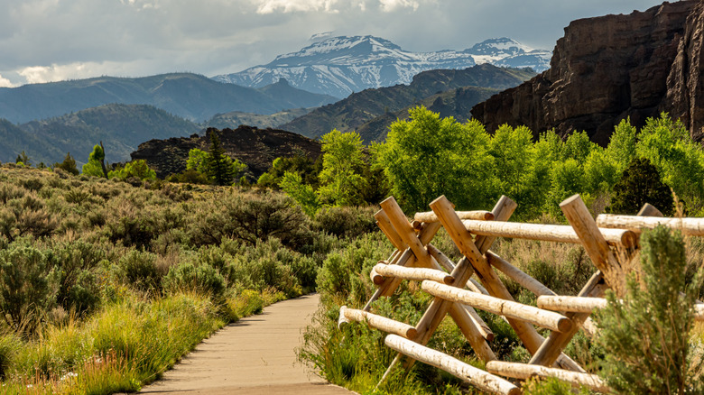 Walking trails along Buffalo Bill Cody Scenic Byway in Wyoming with mountains in the background during the day.