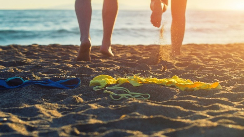 nude couple beach sunset