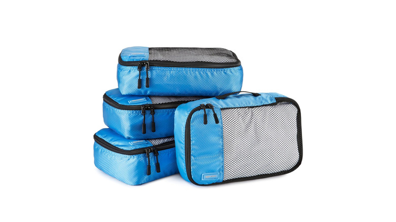 Four small-sized Amazon Basics packing cubes.
