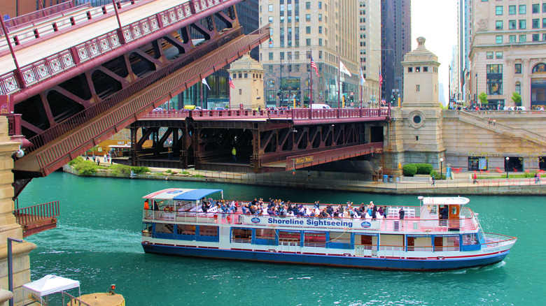 A boat full of tourists on the Chicago River