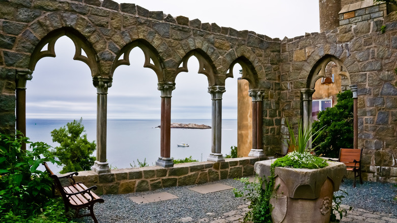 View of the sea looking out through the arched windows of Hammond Castle in Massachusetts