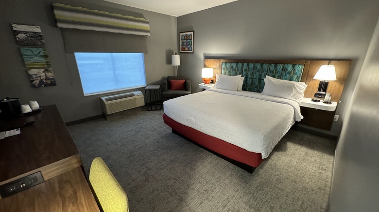 Interior view of room at Hampton Inn & Suites Miami Kendall with bright pops of color on grey walls