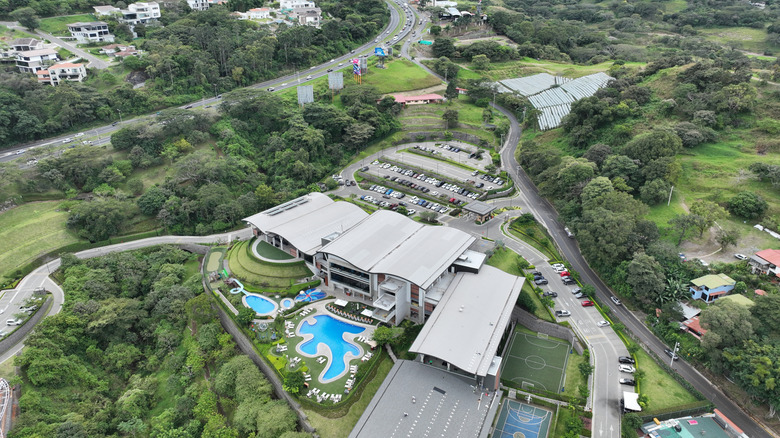 Aerial view of Santa Ana, Costa Rica, surrounded by lush forest
