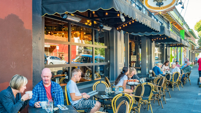 People sitting outside cafe in Alberta Arts District