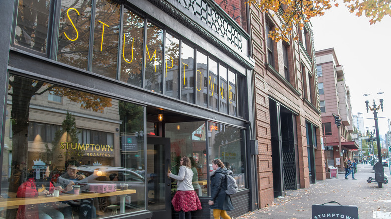 People walk into Stumptown Coffee Roasters