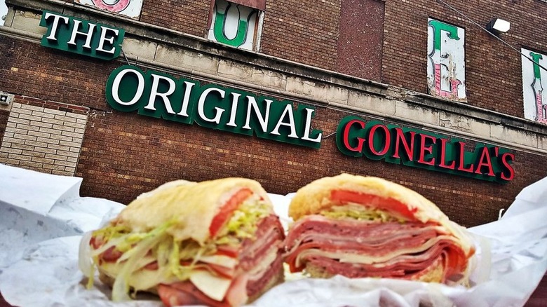 A sandwich with a sign reading the Original Gonella's in the background