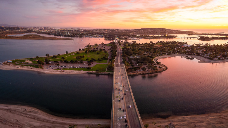 A sunset shot over the inlets of Mission Bay in San Diego with a colorful sky reflected in the sea below