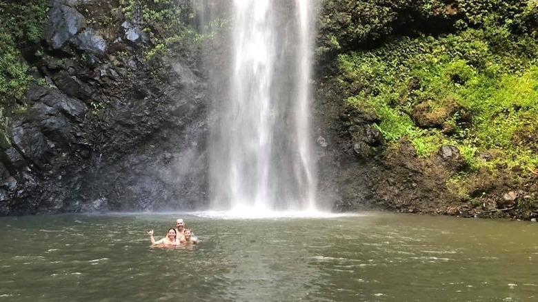 A family at Uluwehi Falls