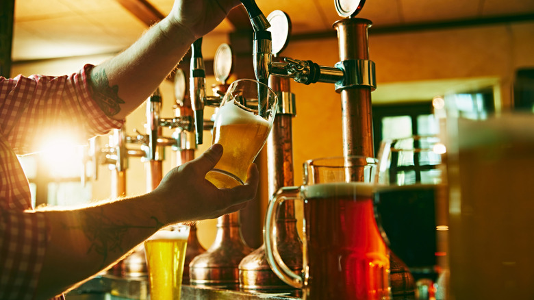 Bar tender pouring a drink