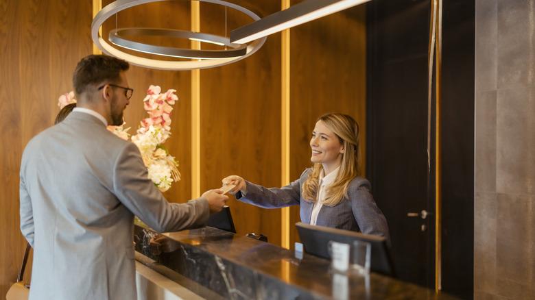 Couple checking into a hotel