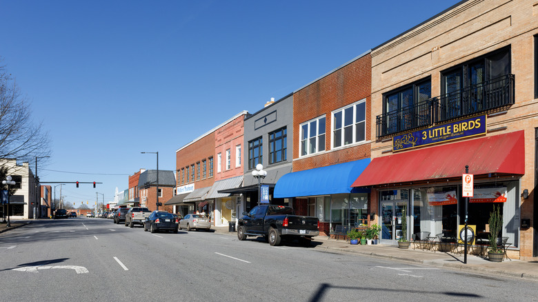 Historic buildings housing shops and restaurants in Downtown Newton on a sunny day.