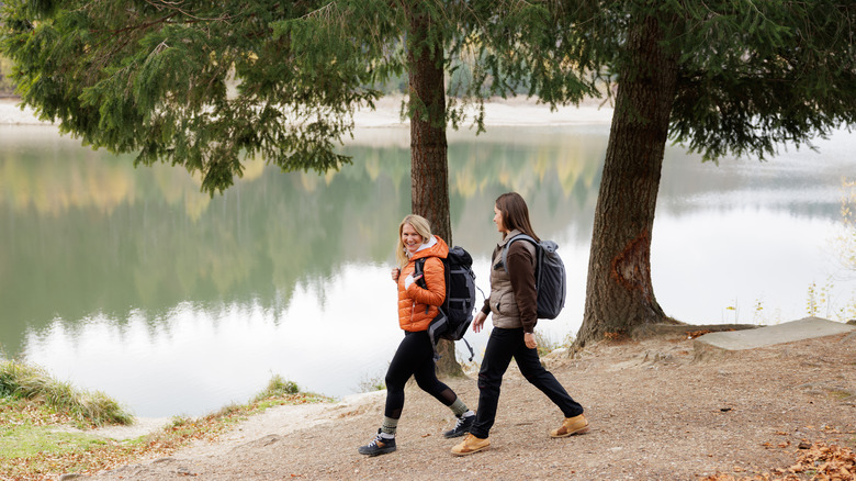 Two women walking with backpacks