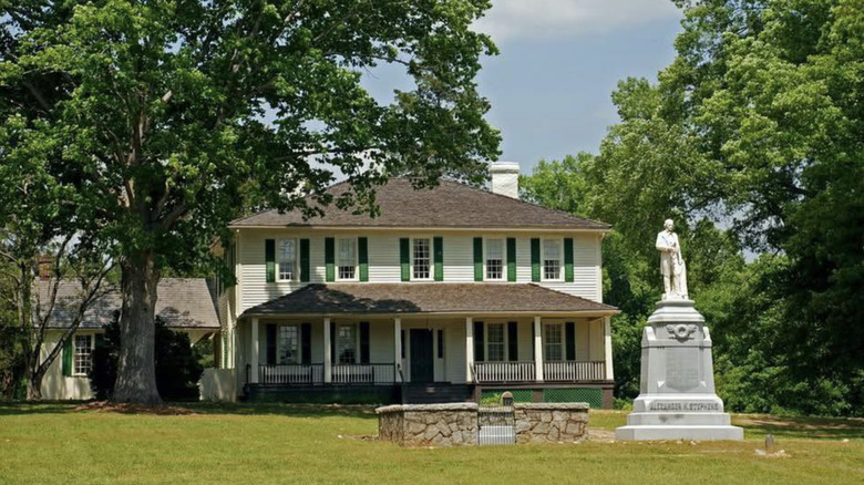 Liberty Hall in AH Stephens State Park with the monument framed by trees
