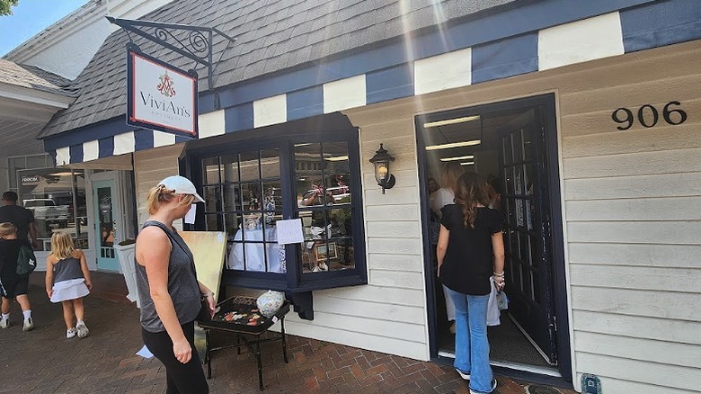 People walking into ViviAn's Antiques in downtown Perry.