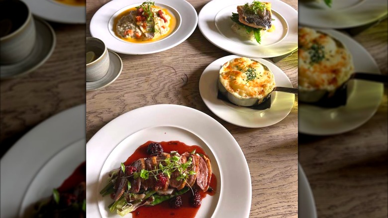 Dishes on a wooden table at The Langley Tap restaurant in Chippenham, Wiltshire