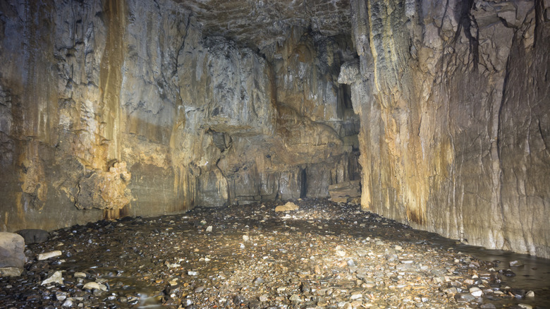 Yellow and white limestone walls of Yordas Cave in Yorkshire Dales, England