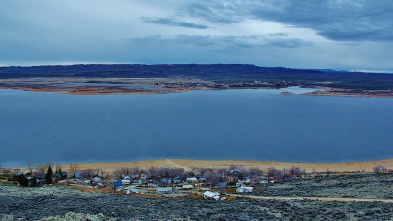 An aerial view of the eastern shore of Magic Resevoir and the resort on a cloudy day during the winter