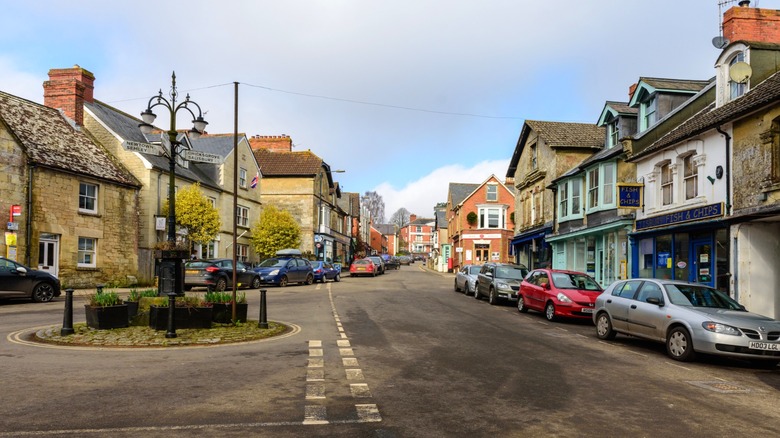 Traditional shops and houses along the street in Tisbury, Wiltshire, England