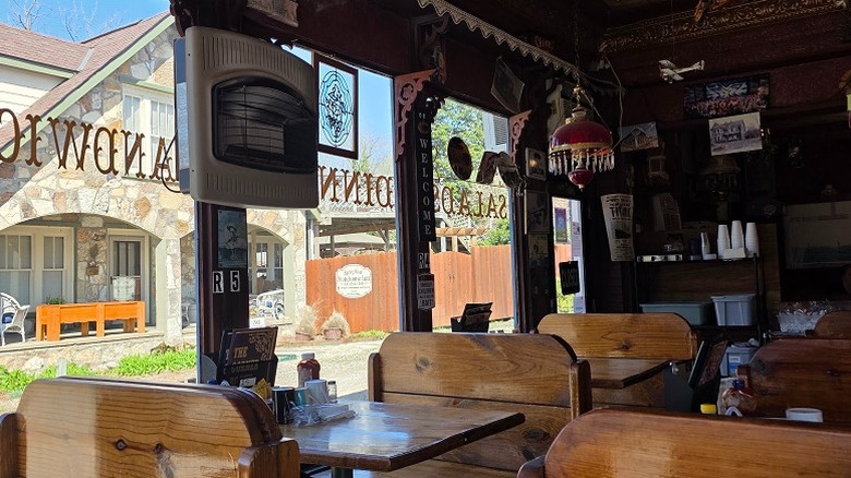 Interior timber booth seating and antique decorations at Corner Booth in Downtown Hardy.