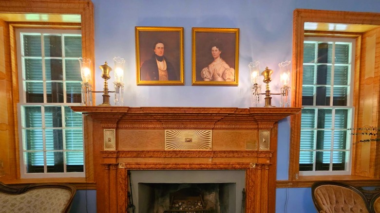 Portraits of William Henry Gist and his wife above the fireplace at Rose Hill Plantation State Historic Site