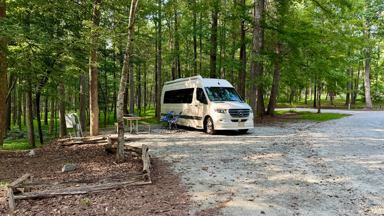 A camper van parked at a campsite