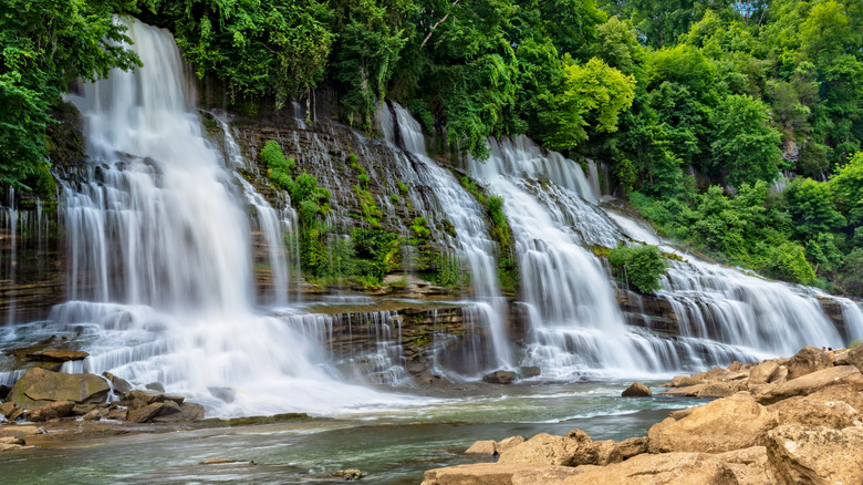 Twin Falls crash over rocky wall into a creek at Rock Island State Park near Spencer, Tennessee