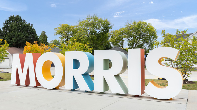 Large Morris sign, with white letters, in the city of Morris, Illinois