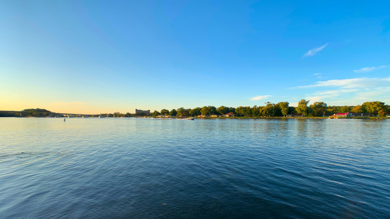 Illinois River with trees and town on the opposite bank at Illini State Park