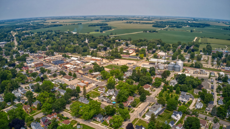 An aerial photo of downtown Genoa, Illinois with old buildings and square blocks surrounded by farmland