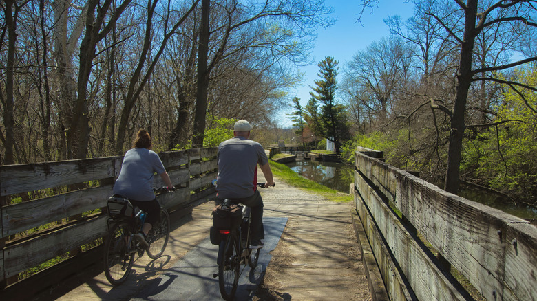 Two cyclists crossing a bridge on the canal near Rockdale, Illinois