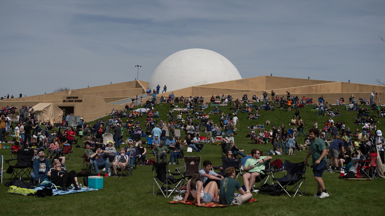 People watch the solar eclipse at the Neil Armstrong Air and Space Museum.