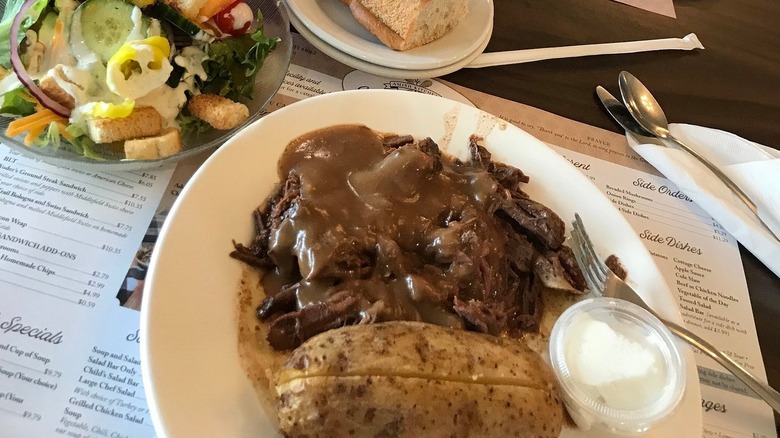 Roast beef, a baked potato, and gravy with a side salad at Mary Yoder's Amish Kitchen in Middlefield, Ohio