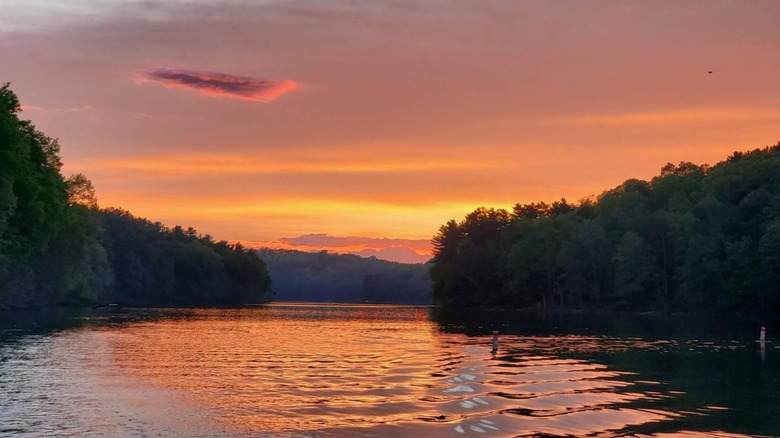 An orange sky at sunset above Leesville Lake in Ohio