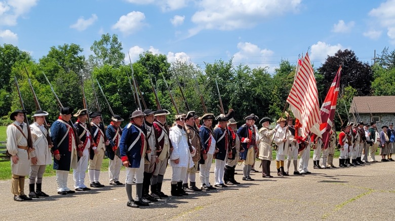 Rows of British and Continental soldiers muster at Fort Laurent's Revolutionary War reenactment.
