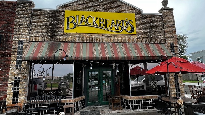 Tables and chairs outside Blackbeard's Too in Ingleside, Texas.