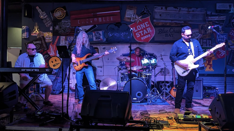 A band performing on stage at the Bedford Ice House.