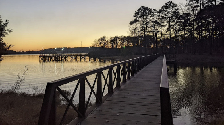 A view over a wooden bridge and fishing pier at Martin Creek Lake State Park