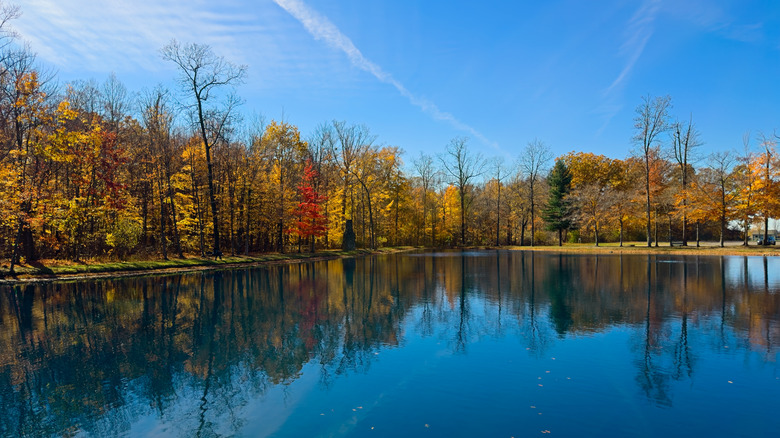Fall colors reflected in Ohio city park lake.