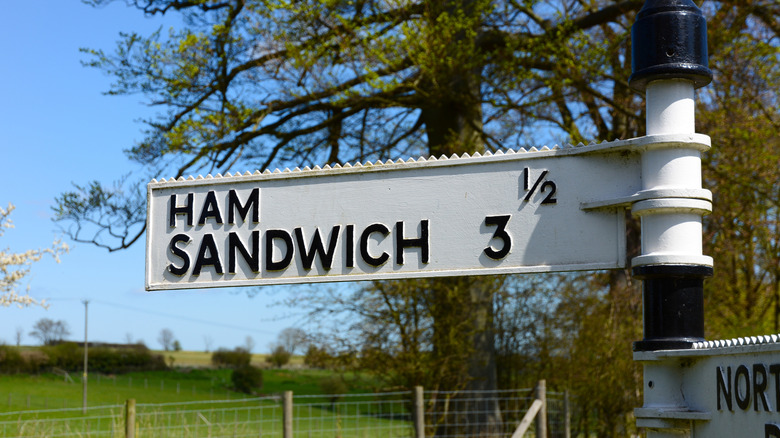 A street sign pointing to Ham and Sandwich towns in the U.K.