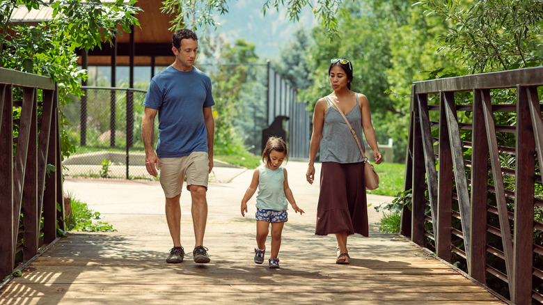 Family crossing bridge at Colorado park