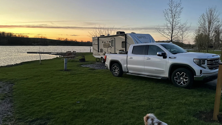 an RV parked right by the edge of Rock Creek Lake in Iowa