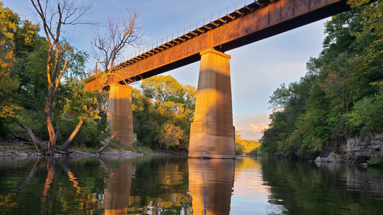 Sun hitting a bridge over the Iowa River in Iowa Falls