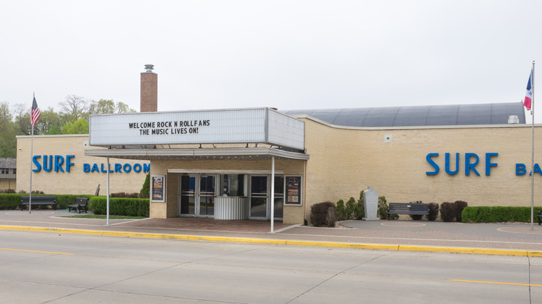 Exterior of Surf Ballroom building, with flags outside