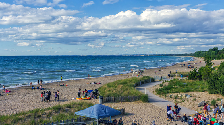 Another angle of the beach on a windier day with some waves and people hanging out in the sand
