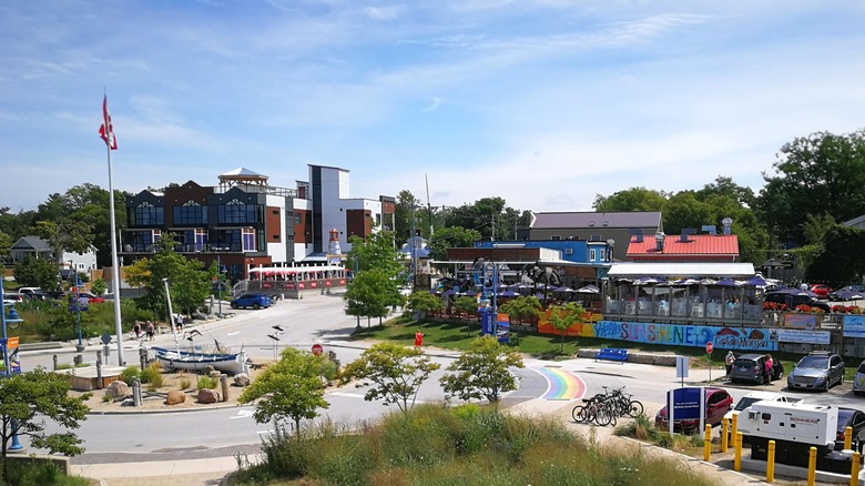 The central roundabout behind the beach in Grand Bend with restaurant patios at the corner of Main Street