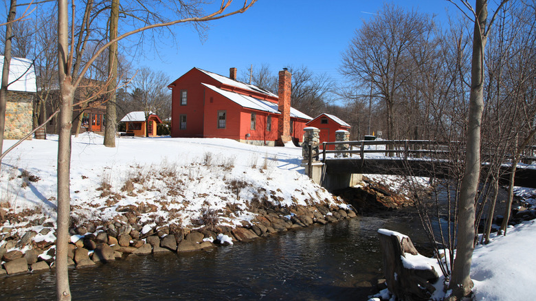 Mill Race Village in Northville, Michigan, with ground covered in snow